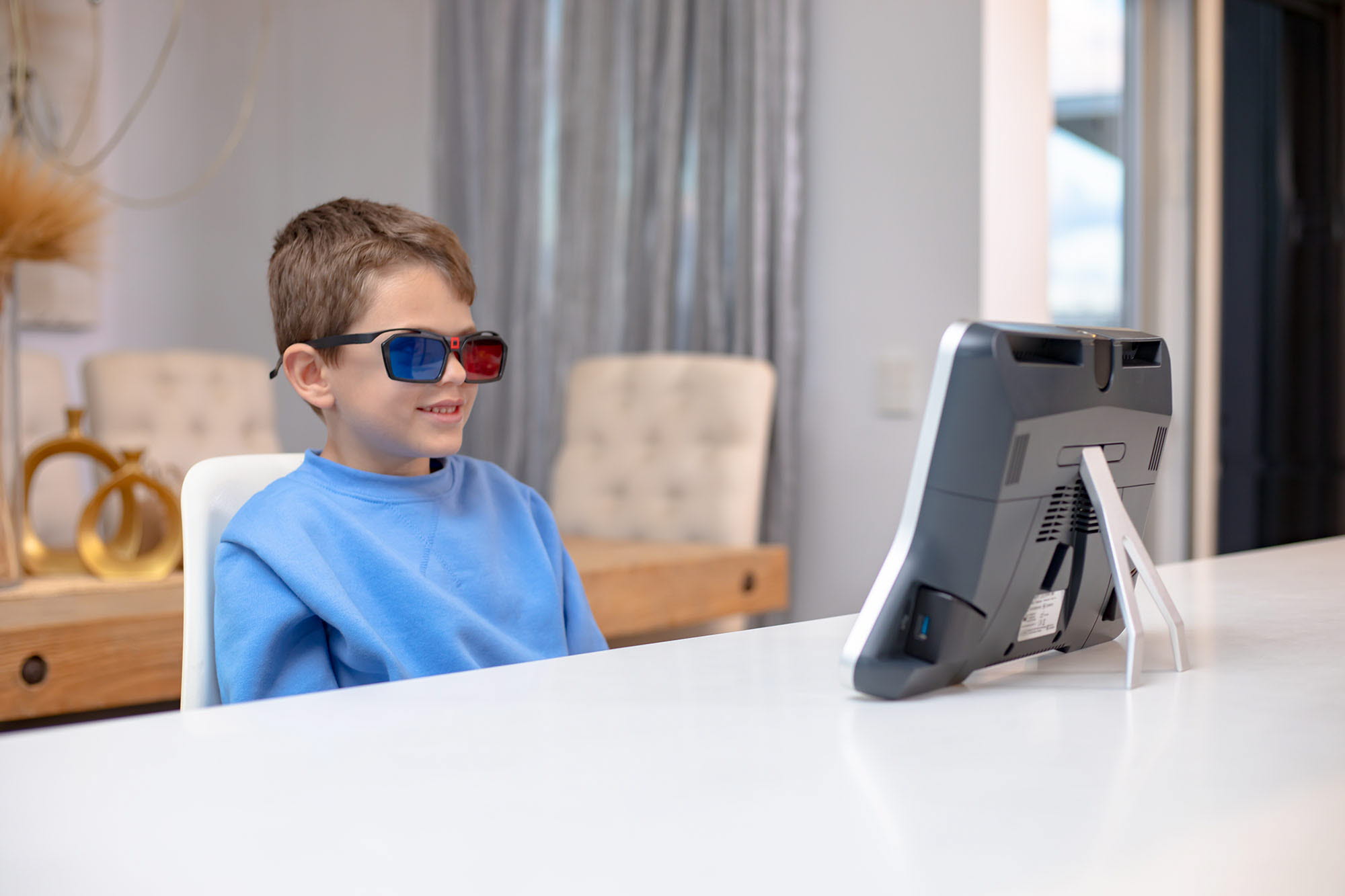 Child wearing 3D glasses NovaSight