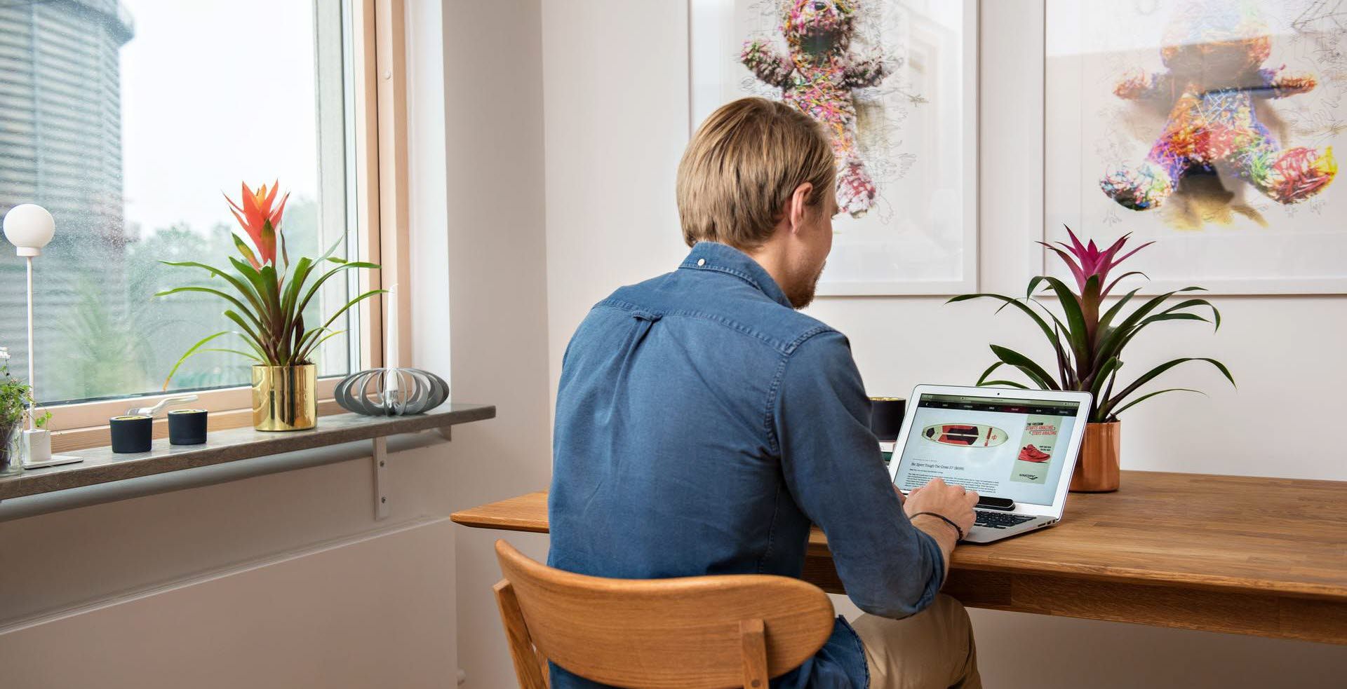 Man at a computer with Tobii Pro Nano