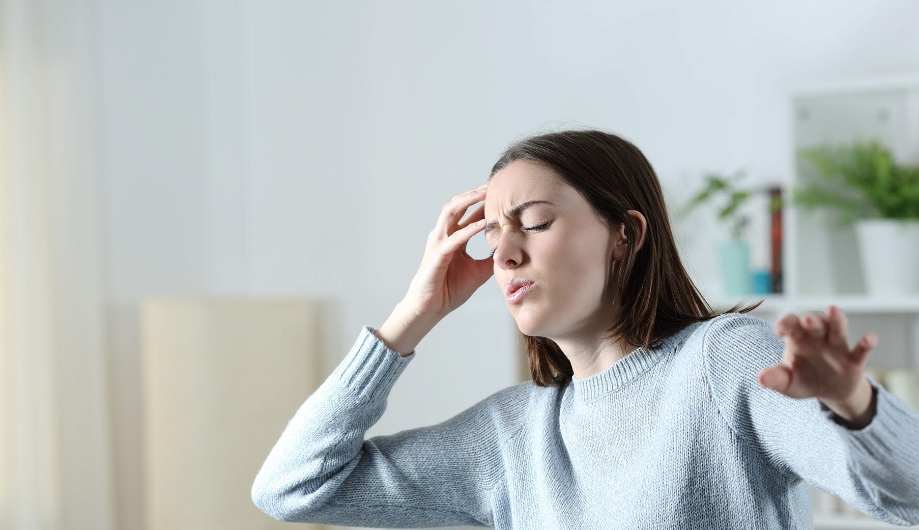 Woman experiencing vertigo