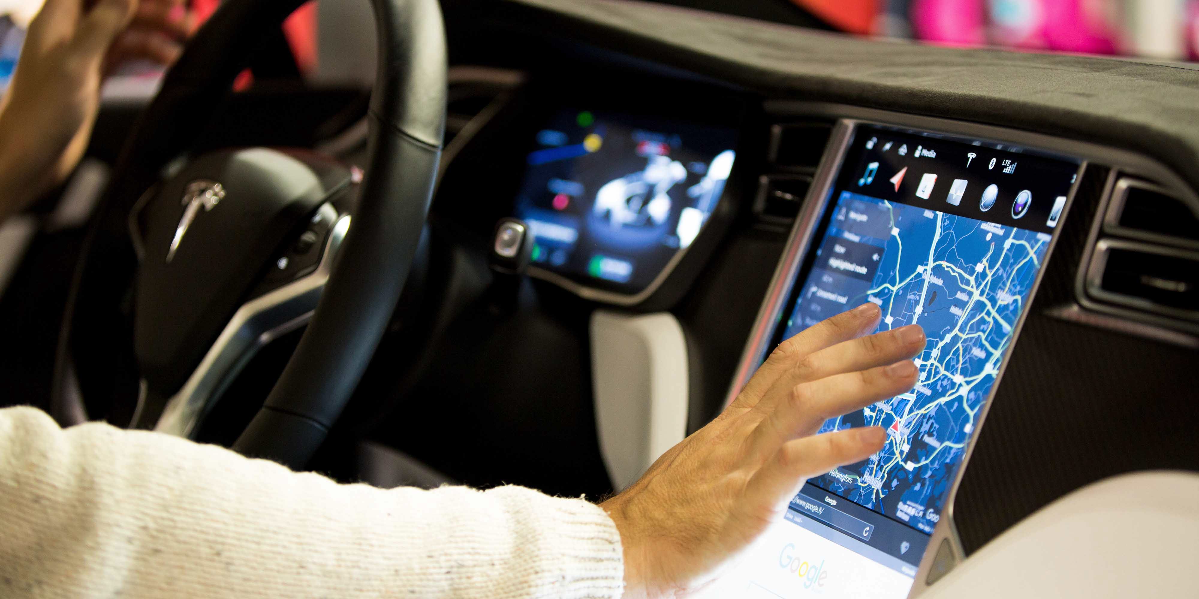 Woman interacting with car interface