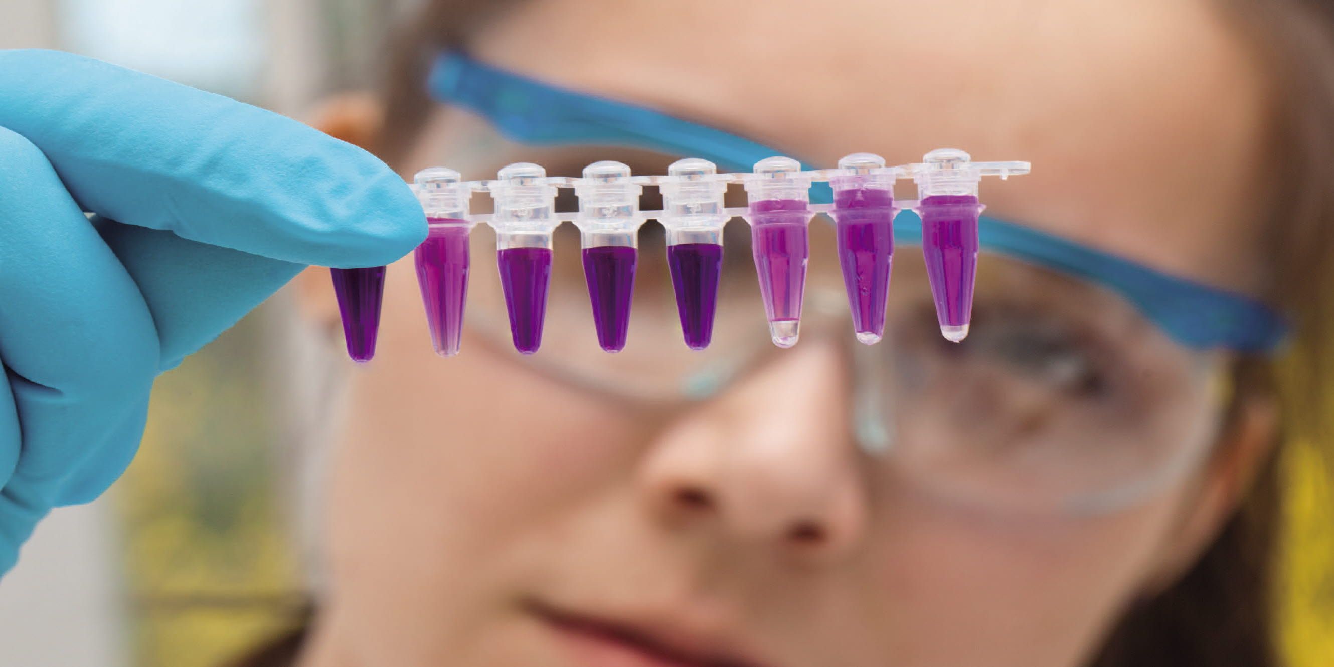 Woman looking at injections in a lab